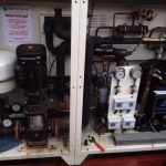 A close-up view of a water pump alongside various pieces of equipment, showcasing intricate details and functionality.